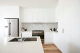 A very clean, white kitchen