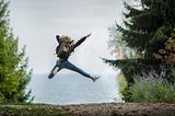 Woman Jumping Wearing Green Backpack. What happens when you do HIIT training for 3 months