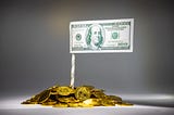 A flag of a 100 dollar bill sitting atop a pile of gold coins.