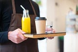 orange juice on a serving tray