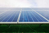Large older style solar panel array in a field