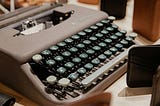 Why are there blocks of wood surrounding this typewriter? This better not be a joke on us the readers…