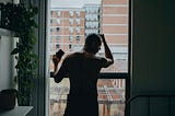 Man on a window ledge.