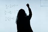 Picture of a women writing partial derivatives