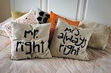 Mr & Mrs Right cushions on a bed