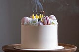 Smoke rising from recently extinguished candles on a birthday cake