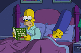 Homer Simpson reading a book.