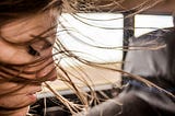 woman looking through the car window