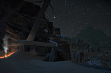A campfire burning under a rocky overhang. To the right, an open vista of trees and starry sky. The image is from the game The Long Dark.