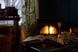 A book and cup of tea in front of the fire can be the perfect beginning for an evening routine.