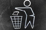 a chalkboard drawing of a person throwing something in the trash can