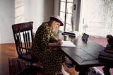 Woman writing at a desk