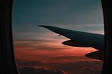 view of an airplane wing and the sky