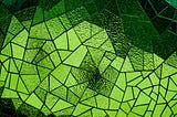 A lime green abstract (with some shades of black) of a glass mosaic with a black background