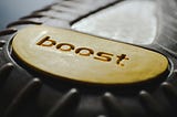 A yellow button with the word boost on it.
