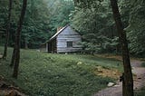 An old, wooden cabin in the woods