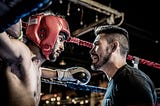trainer and boxer in corner