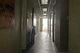 dark hall with door at the end