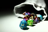 Image showing a bag of dice used in roleplaying games. Shows various sizes of polyhedral dice.