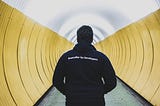 Man walking in underground tunnel