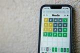 phone with Wordle game on it