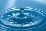 Water drop in blue background