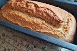 loaf tin with baked beer bread