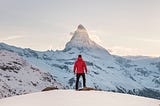 A man looking towards a mountain top