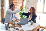 Two business perople celebrating a deal