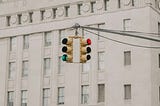An image of street with focus on signal lights to signify the trade-offs in decision making