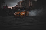 A yellow car drifting.