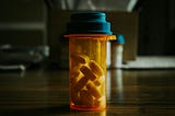 A bottle of pills on a table