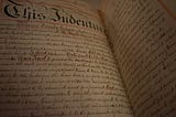 A photo of what appears to be a historical document of an Indenture. It is written in cursive script. It is quite lengthy, and the two pages are filled with text.