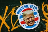 A sticker of former President Trump which reads: “Miss me yet?”