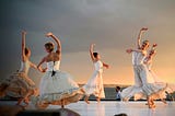 Women dance on a stage