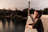 Kid thinking on a bridge