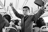 preacher preaching on a bus in Guatemala