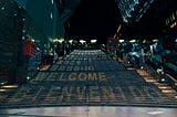 stairs with welcome written in different languages on each step, starting with Bienvenido, then welcome, etc.
