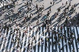 A crowd of people crossing the street in Shibuya