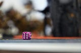 A Die Game Puzzle by the Numbers