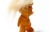 A doll caricature of President Trump — with wild hair and no clothes.