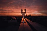 goblet with a red sunset background