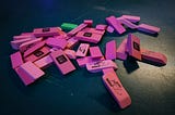 A small, messy pile of pink erasers