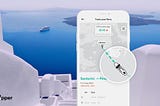 The ferry tracking feature of the Ferryhopper App and white Cycladic houses in Santorini in the background