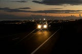 Driving on a Road Lit By Bombs