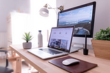 Laptop and desktop computer on desk