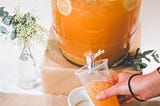 Image of juice in a clear plastic cup