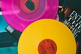 Neon colored record disks.