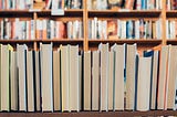 shelf of books with the pages facing