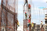 Workers architecting a building